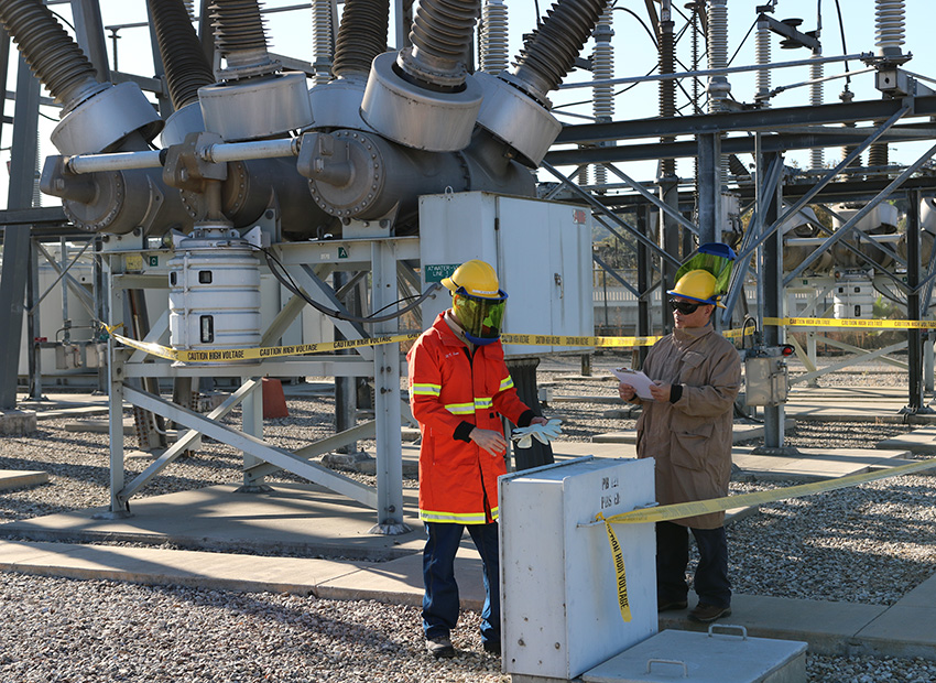Two operators at a LADWP electric station. 